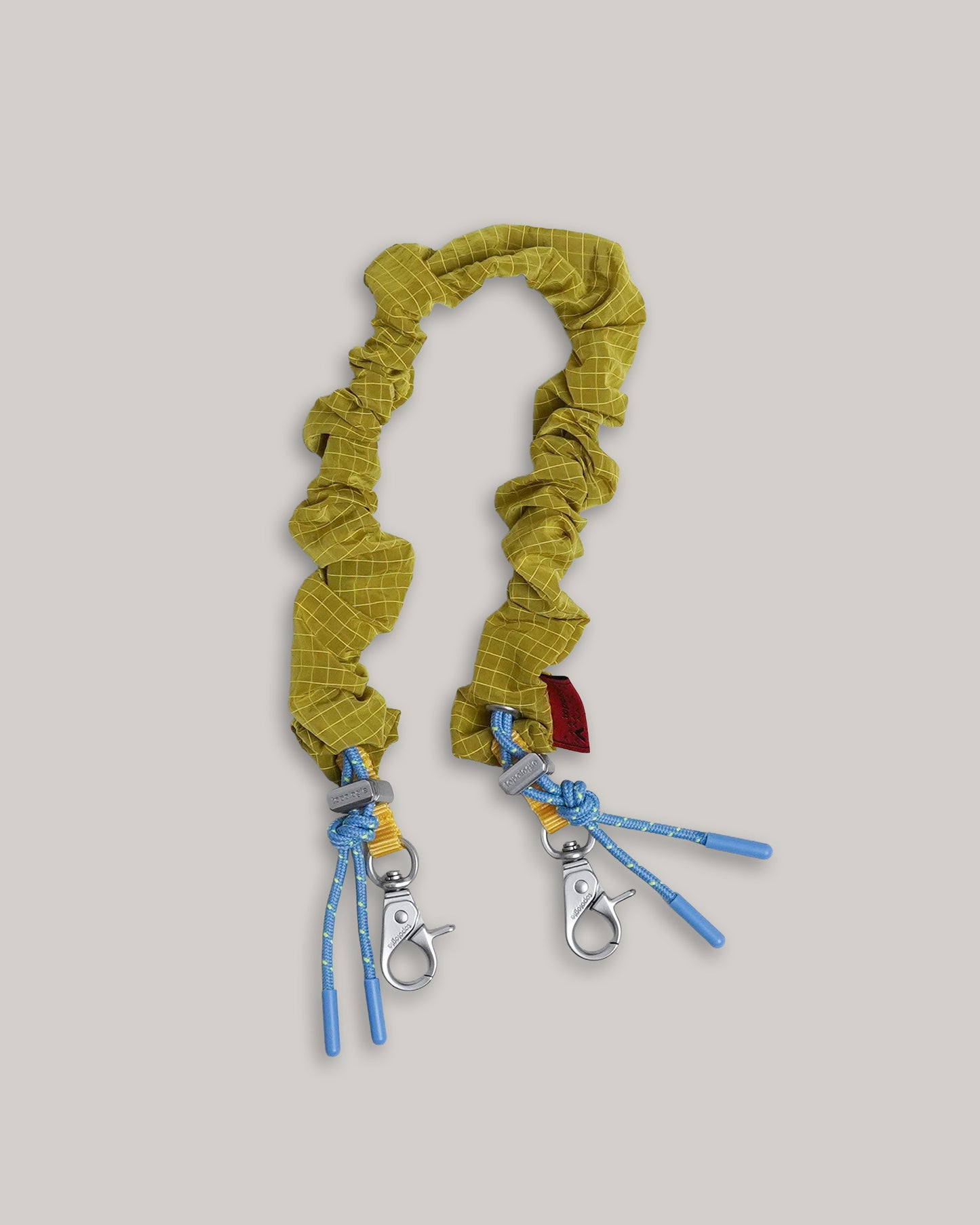 TOPOLOGIE BUNGEE WRIST STRAP MUSTARD